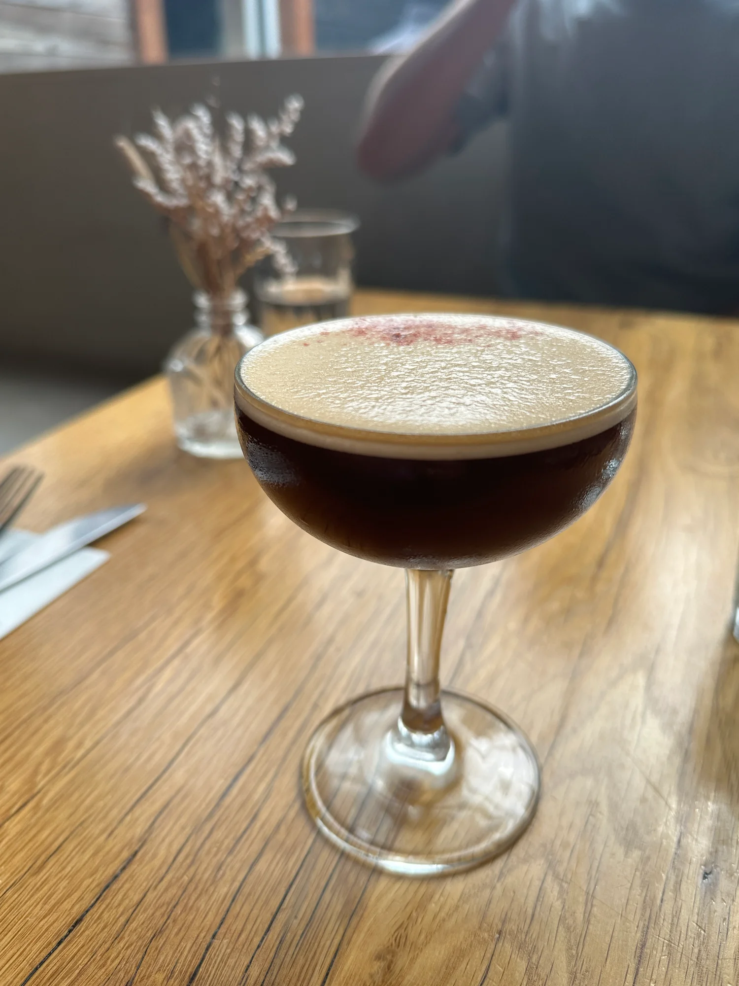 Close-up of the strawberry-noted shaken espresso in a coupe glass at cafe olli, Portland