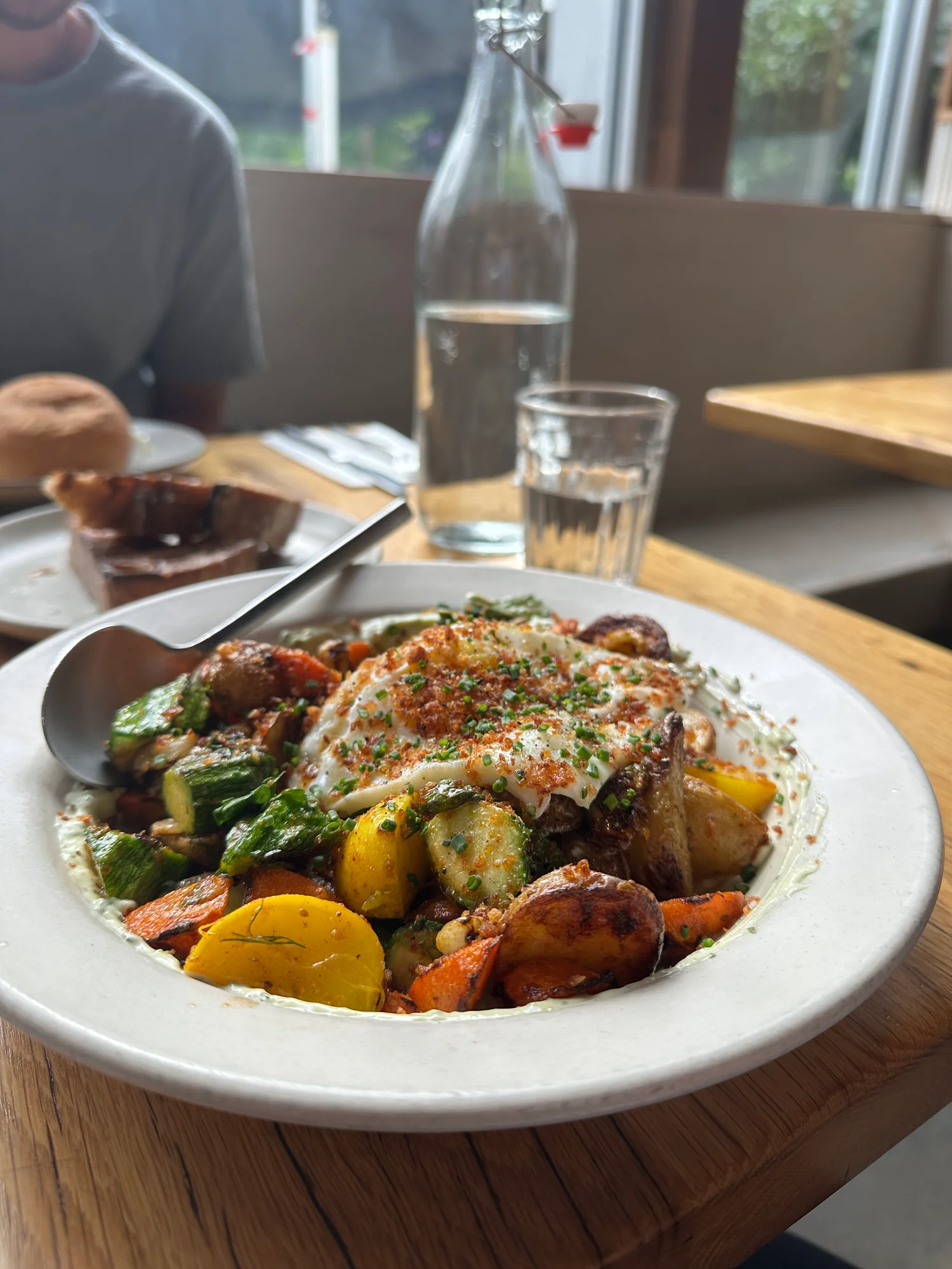 A farm-to-table vegetable hash with fried egg at cafe olli in Portland