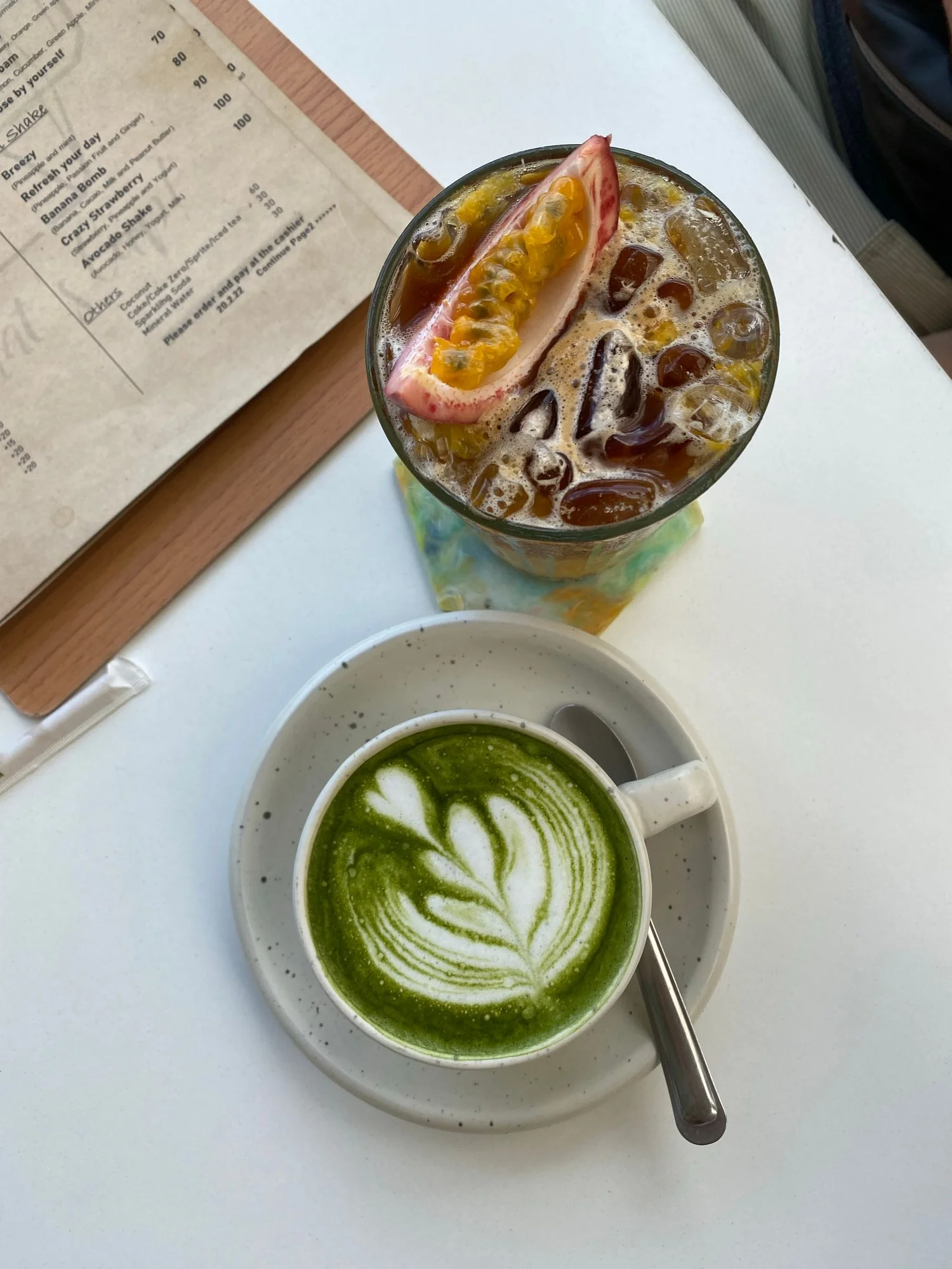 A matcha latte beside a fruit drink, like the fruit matcha at Kiss of Matcha in San Francisco