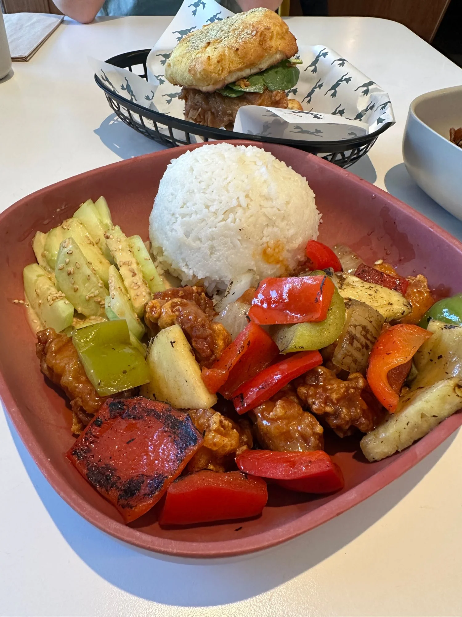 The Sweet & Sour Chicken Rice Plate at Mamahuhu on Clement Street in San Francisco, with charred peppers, grilled pineapple, jasmine rice and sesame cucumbers