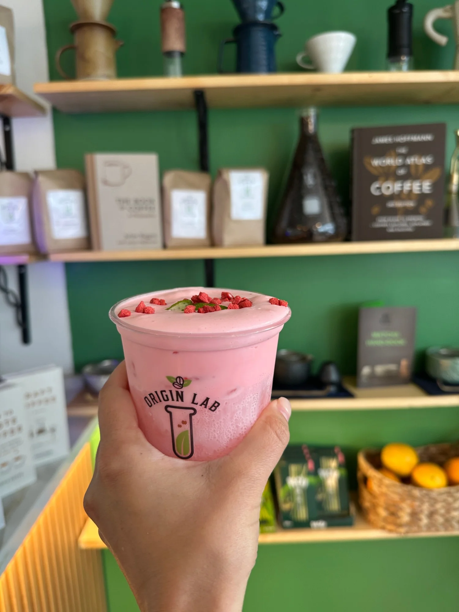 The Sparkling Strawberry Nimbus at Origin Lab Coffee and Matcha in San Francisco, a pink strawberry cloud drink topped with freeze-dried strawberries