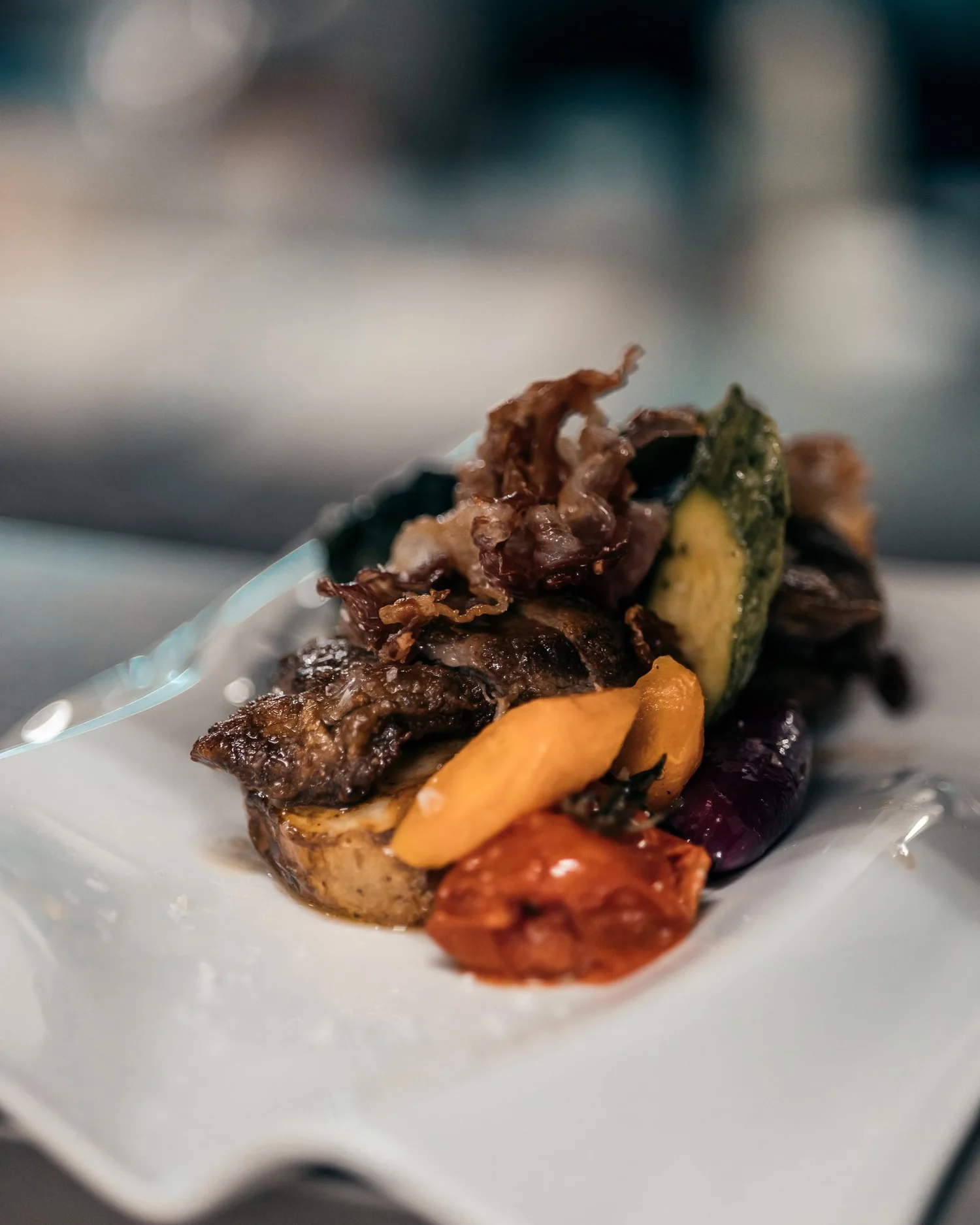 A composed dinner plate like the cooking at RT Bistro in San Francisco