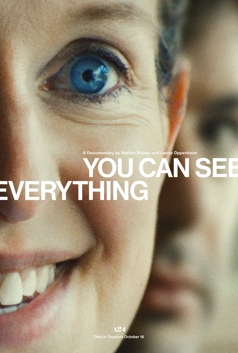 Theatrical poster for You Can See Everything, a documentary by Nathan Fielder and Lance Oppenheim: an extreme close-up of a smiling woman with one wide blue eye, the title in white capital letters across her face
