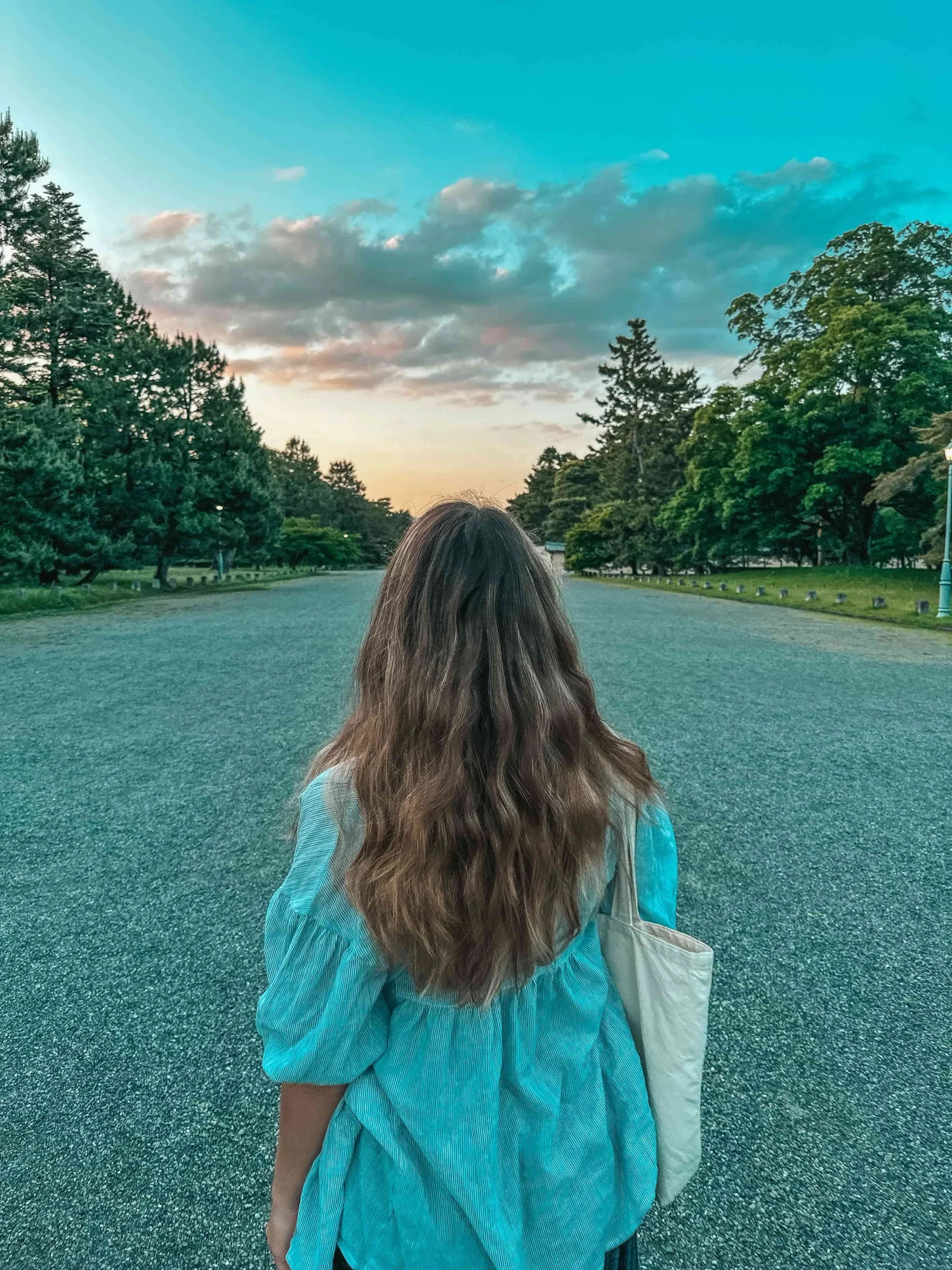 Freelance writer in Kyoto, Japan walking through temple gardens — writing novels and working remote tech writing jobs while traveling.